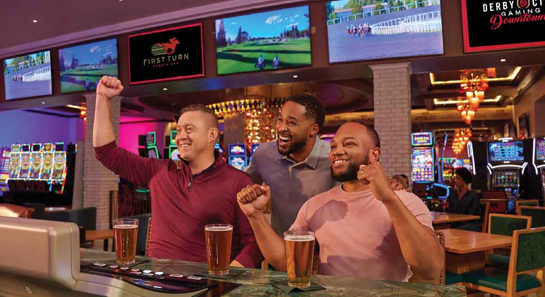 Men at First Turn Sports bar watching game at Derby City Downtown